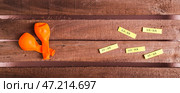 Happy April Fools Day, balloons and funny notes on wooden top view web banner. Стоковое фото, фотограф Елена Руй / Фотобанк Лори