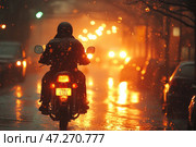A motorcyclist riding on a rainy city street at night. The road is wet, reflecting the light of headlights and street lamps, creating a warm atmosphere of contrast between the rain and golden lights. The raindrops illuminated by the light create an effect of mystery and solitude. The motorcyclist in dark gear and a helmet moves forward, which symbolizes aspiration, loneliness and freedom. The background is blurred, and the city lights turn into a bokeh effect. Стоковое AI-изображение, AI-художник Анна Кривицкая / Фотобанк Лори