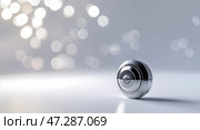 Sleek metallic object with a shiny finish against a blurred background of soft lights. Стоковое AI-изображение, AI-художник Сергей Толмачёв / Фотобанк Лори