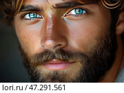 Close-up of a man with deep blue eyes, thick eyebrows and an expressive beard. His skin has a warm tan, and the lighting highlights the natural texture of his face, including light stubble and tiny pores. The man's gaze is piercing and mysterious, creating a sense of strength, confidence and attractiveness. The image is made in a realistic style, conveying details with high clarity. Стоковое AI-изображение, AI-художник Анна Кривицкая / Фотобанк Лори