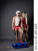 Couple engaging in playful roleplay at home with themed outfits and props. Стоковое фото, фотограф Гурьянов Андрей / Фотобанк Лори
