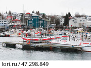 Fishing boats are secured at a quaint harbor (2017 год). Редакционное фото, фотограф EugeneSergeev / Фотобанк Лори