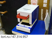 Osaka, Japan - Sep 22 2024, Close up view of the eki stamp, station stamping machine, at JR railway station, Osaka, Japan. Редакционное фото, фотограф Сергей Богомяко / Фотобанк Лори