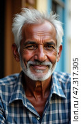 An elderly man from India sits contentedly, showcasing his joyful smile and wisdom. His plaid shirt reflects his character against the colorful backdrop of his surroundings. Стоковое AI-изображение, AI-художник Юлия Петровская / Фотобанк Лори