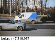 Car of the Yandex drive car sharing company driving on high speed. Fast moving van on city road with blurred background. Редакционное фото, фотограф Константин Григорьев / Фотобанк Лори