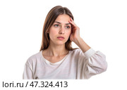 Young woman with long brown hair wearing white casual blouse touching head with hand looking thoughtful trying to remember something isolated on white background. Стоковое AI-изображение, AI-художник Павел Муравьев / Фотобанк Лори