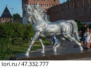 Tula, Russia - 24 July, 2024. Kremlin Installation of a horse made of metal letters near the Kremlin wall. Kazanskaya embankment of Tula. Редакционное фото, фотограф Оксана Медведева / Фотобанк Лори