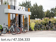 A bicycle or scooter rental point or point. Rent, hire, business. Russia, Moscow region, June 23, 2024. Редакционное фото, фотограф Photojuli / Фотобанк Лори