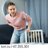 Young woman suffering from abdominal pain. Стоковое фото, фотограф Яков Филимонов / Фотобанк Лори