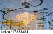 Abu Dhabi, United Arab Emirates - Jan 10 2024, View of giant chandelier inlaid with Swarovski crystals in reflection on marble floor the Grand Mosque of Sheikh Zayed Abu Dhabi, United Arab Emirates. Редакционное фото, фотограф Сергей Богомяко / Фотобанк Лори