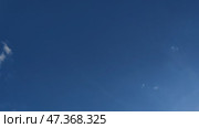 Clouds are floating across the sky. Light Blue sky almost without clouds, rare clouds quickly move across the sky. Cumulus clouds quickly appear out of nowhere and quickly dissolve in the air. Стоковое видео, видеограф Andrew_Swarga / Фотобанк Лори