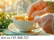 Чаепитие, пожилой человек кладет кусочек сахара в чашку с чаем. Стоковое AI-изображение, AI-художник Щеголева Ольга / Фотобанк Лори