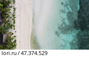 Aerial top view of beautiful tropical sandy beach. Стоковое фото, фотограф Михаил Коханчиков / Фотобанк Лори