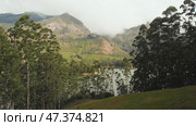 Aerial view beautiful nature with mountains and hills by Lake Mattupetty. Kerala State. Near the city of Munar. Стоковое фото, фотограф Mikhail Davidovich / Фотобанк Лори