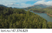 Aerial view beautiful nature with mountains and hills by Lake Mattupetty. Kerala State. Near the city of Munar. Стоковое фото, фотограф Mikhail Davidovich / Фотобанк Лори