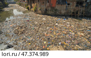 Dirty river in Dharavi slums. Mumbai. India. Стоковое фото, фотограф Mikhail Davidovich / Фотобанк Лори