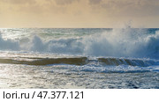 Alanya, Antalya, Türkiye, Turkey, Panoramic view of the storm, large waves with sea foam rolling onto the beach, at sunset, the Mediterranean Sea (2023 год). Стоковое фото, фотограф Сергей Богомяко / Фотобанк Лори