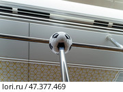 Doha, Qatar - Jan 06 2024, a close up view of football ball shaped handrail, railing in van of Doha metro, subway,  in honour of 2022 FIFA World Cup, Doha, Qatar. Редакционное фото, фотограф Сергей Богомяко / Фотобанк Лори