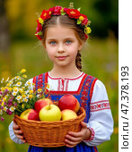 A little girl in a Russian sarafan with a basket of fresh ripe apples. August 19 – Transfiguration of the Lord, or Apple Savior – one of the first harvest holidays; the day from which, according to legend, nature moved from summer to autumn and winter. Стоковое AI-изображение, AI-художник Сергей Елизарьев / Фотобанк Лори