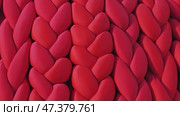 Red braided fabric creating a textured background, perfect for design projects. Стоковое видео, видеограф Mikhail Davidovich / Фотобанк Лори