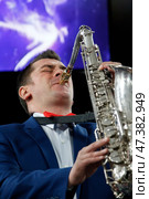 Belarus, Gomel, the performance of the Gomel city orchestra. March 29, 2017.Playing the saxophone.Profession musician. Saxophonist. Performing Jazz. Редакционное фото, фотограф Лазаренко Светлана / Фотобанк Лори