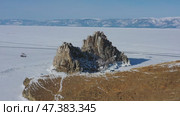 Shaman rock in frozen lake Baikal. Стоковое видео, видеограф Михаил Коханчиков / Фотобанк Лори