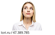 Young blonde woman in white shirt looking up with thoughtful expression, thinking about something important, isolated on white background, close-up portrait. Стоковое AI-изображение, AI-художник Павел Муравьев / Фотобанк Лори