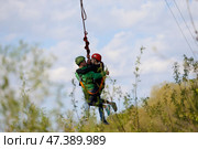 Belarus, Gomel, May 01, 2017.Jumping with a rope.Love couple jumping with rope.Engage in extreme sports. Risky love story. Редакционное фото, фотограф Лазаренко Светлана / Фотобанк Лори