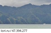 The Busuanga mountains are covered with a tropical forest. Palawan Island with blue water. Journey on the ship. The city of Coron in the Philippines. Стоковое видео, видеограф Mikhail Davidovich / Фотобанк Лори