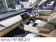 Elegant interior of Land Rover Range Rover SV with cream leather seats. London, UK, 24 December 2023. Редакционное фото, фотограф Zydrius Tartenis / Фотобанк Лори