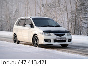 KRASNOYARSK, RUSSIA - February 2, 2025: White Mazda Premacy. Редакционное фото, фотограф Плотников Дмитрий / Фотобанк Лори