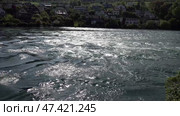 Река Рейн в городе Шаффхаузен. Швейцария. Май. The Rhine River in the city of Schaffhausen. Switzerland. May. Стоковое видео, видеограф Горшков Александр / Фотобанк Лори