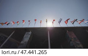 Flags of the world hover over the building. (2018 год). Редакционное видео, видеограф Mikhail Davidovich / Фотобанк Лори
