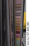 Colorful fabric samples in a textile shop, Close-up of a palette of textile abstract stripes of different colors. Стоковое видео, видеограф Дмитрий Нечаев / Фотобанк Лори
