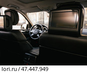 Novosibirsk, Russia -  March  23, 2024: Mercedes-Benz GL-class, monitor for watching tv back seat. Стоковое фото, фотограф Виталий Сова / Фотобанк Лори