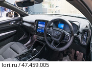 Volvo XC40 cockpit featuring infotainment screen and controls. London, UK, 31 December 2023. Редакционное фото, фотограф Zydrius Tartenis / Фотобанк Лори