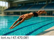 Competitive Swimmer Dives Into Pool During Practice at Sports Complex Early in the Morning. Стоковое AI-изображение, AI-художник Юлия Гапеенко / Фотобанк Лори