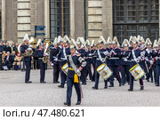 STOCKHOLM, SWEDEN - APRIL 30, 2018: A military band performs at the ceremony to celebrate the 72nd birthday of King Carl XVI Gustaf at the Royal Palace in Stockholm. Редакционное фото, фотограф Сергей Комаров / Фотобанк Лори