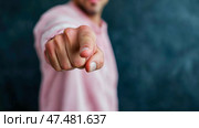 Direct Action: A hand points intently, commanding attention and immediate response from the viewer, with a pink shirt. Стоковое AI-изображение, AI-художник Данила Большаков / Фотобанк Лори