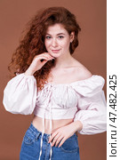 Studio portrait of a red-haired girl. Стоковое фото, фотограф Андрей Аркуша / Фотобанк Лори