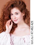Studio portrait of a red-haired girl. Стоковое фото, фотограф Андрей Аркуша / Фотобанк Лори