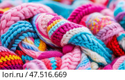 Vibrant Strands: Multicolored Knitted Wool Yarn Textile Close-Up, Warm and Cozy Material for Fashion, Craftwork, or Winter. Стоковое AI-изображение, AI-художник Данила Большаков / Фотобанк Лори