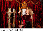 Mystical Moments Captured in a Regal Indoor Setting With Enchanting Decor and Candlelight. Стоковое фото, фотограф Aleksandr Golubev / Фотобанк Лори