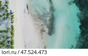 Aerial top view of beautiful tropical sandy beach. Стоковое фото, фотограф Михаил Коханчиков / Фотобанк Лори