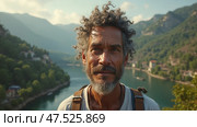 Man with a beard and gray hair is standing in front of a river. Стоковое AI-изображение, AI-художник Sergey Grishin / Фотобанк Лори