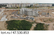 Construction of apartment buildings. Drone view. Стоковое видео, видеограф Mikhail Davidovich / Фотобанк Лори