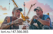 Dock workers enjoying coffee break at sunset. Стоковое AI-видео, аниматор Юрий Поздников / Фотобанк Лори