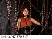 Expressing Strength and Individuality Through Fashion in an Artistic Urban Setting. Стоковое фото, фотограф Aleksandr Golubev / Фотобанк Лори
