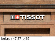 Moscow, Russia - 08.26.2024: Tissot store logo sign on a wall. Tissot is a Swiss watchmaker and the company was founded in Le Locle, Switzerland. Редакционное фото, фотограф Ирина Михайличенко / Фотобанк Лори