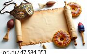 Festive Celebration of Purim With the Scroll of Esther, Hamantaschen, and Colorful Rattles on a White Background. Стоковое AI-изображение, AI-художник Sergey Grishin / Фотобанк Лори